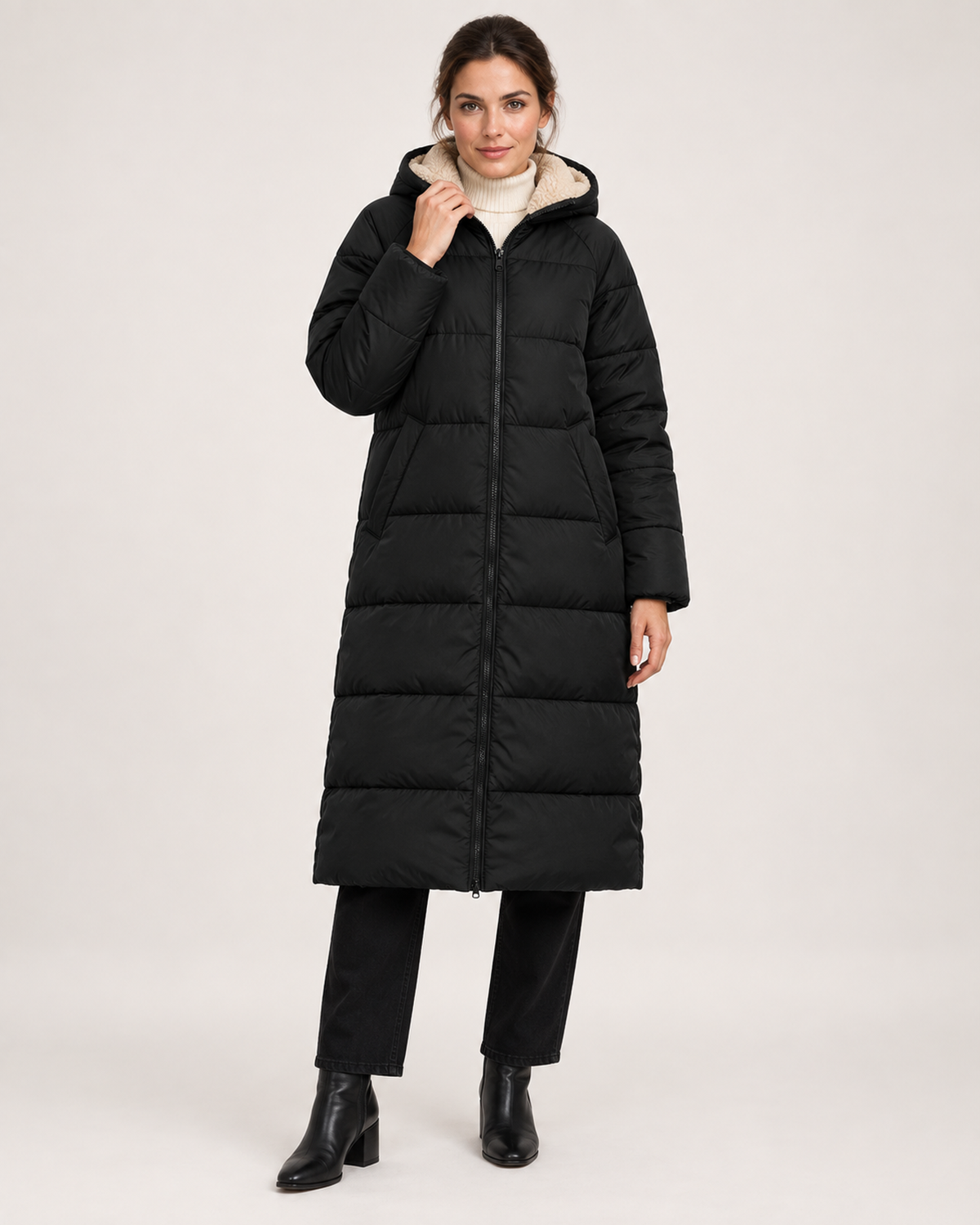 Women’s black long puffer coat fully closed front hero view