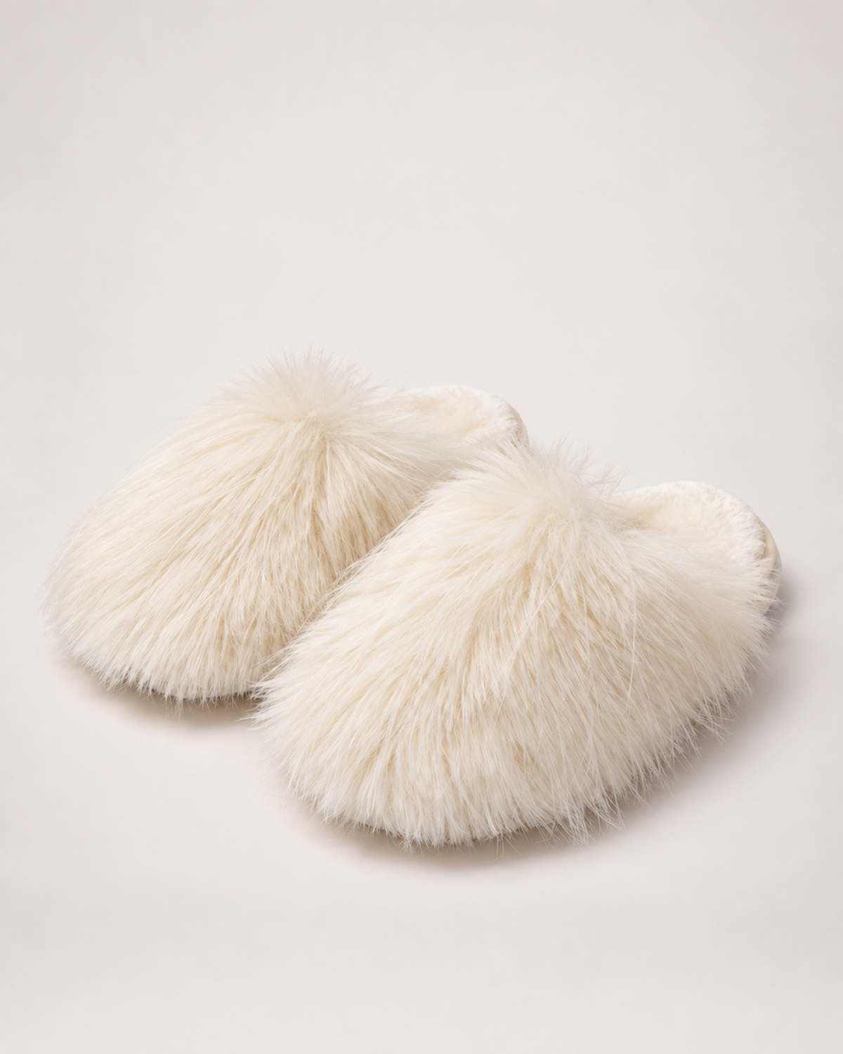 Women’s Mule Slippers with Fluffy Closed Toe in Cream, product only pair front three quarter view