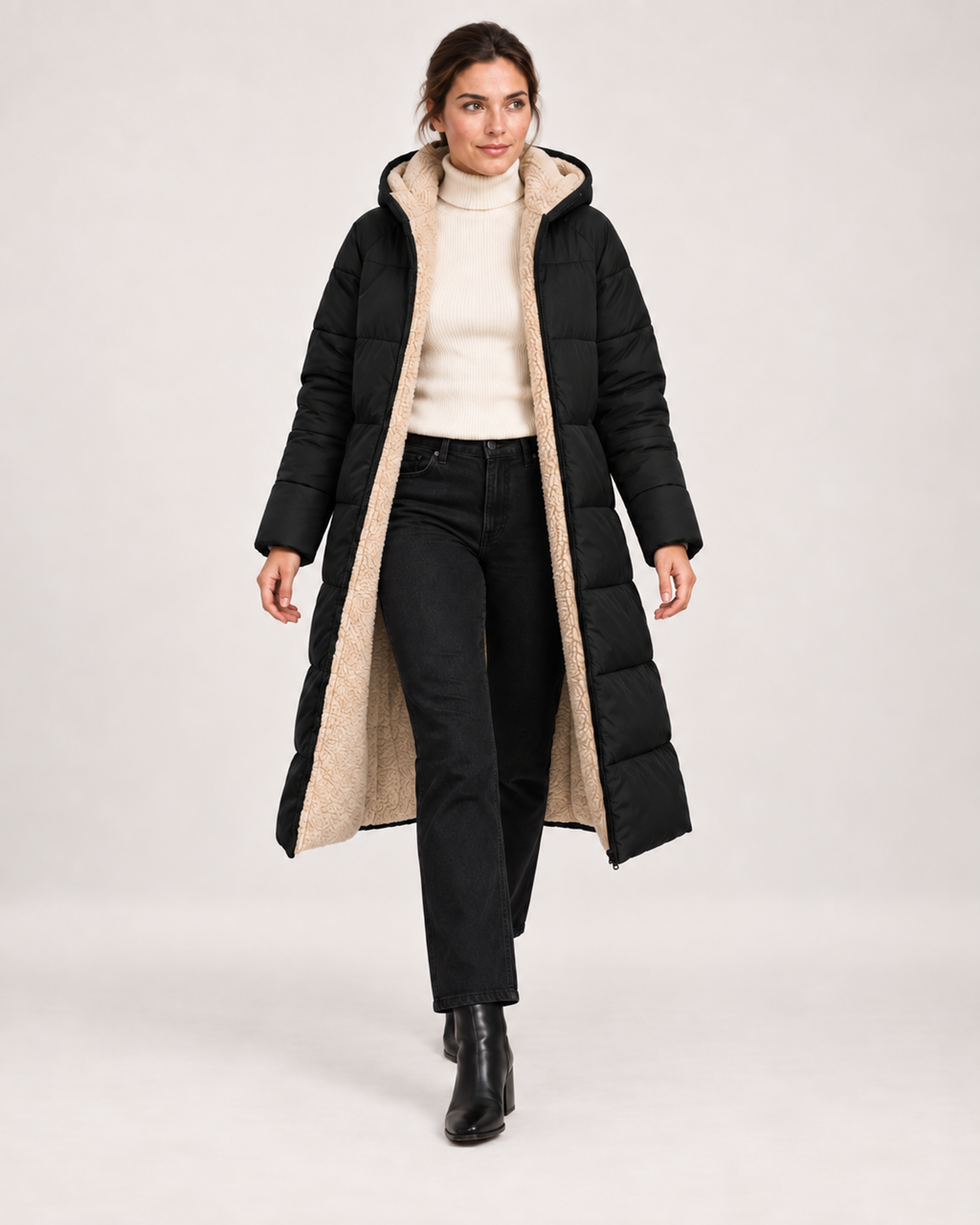 Women’s black long puffer coat open full body walking view