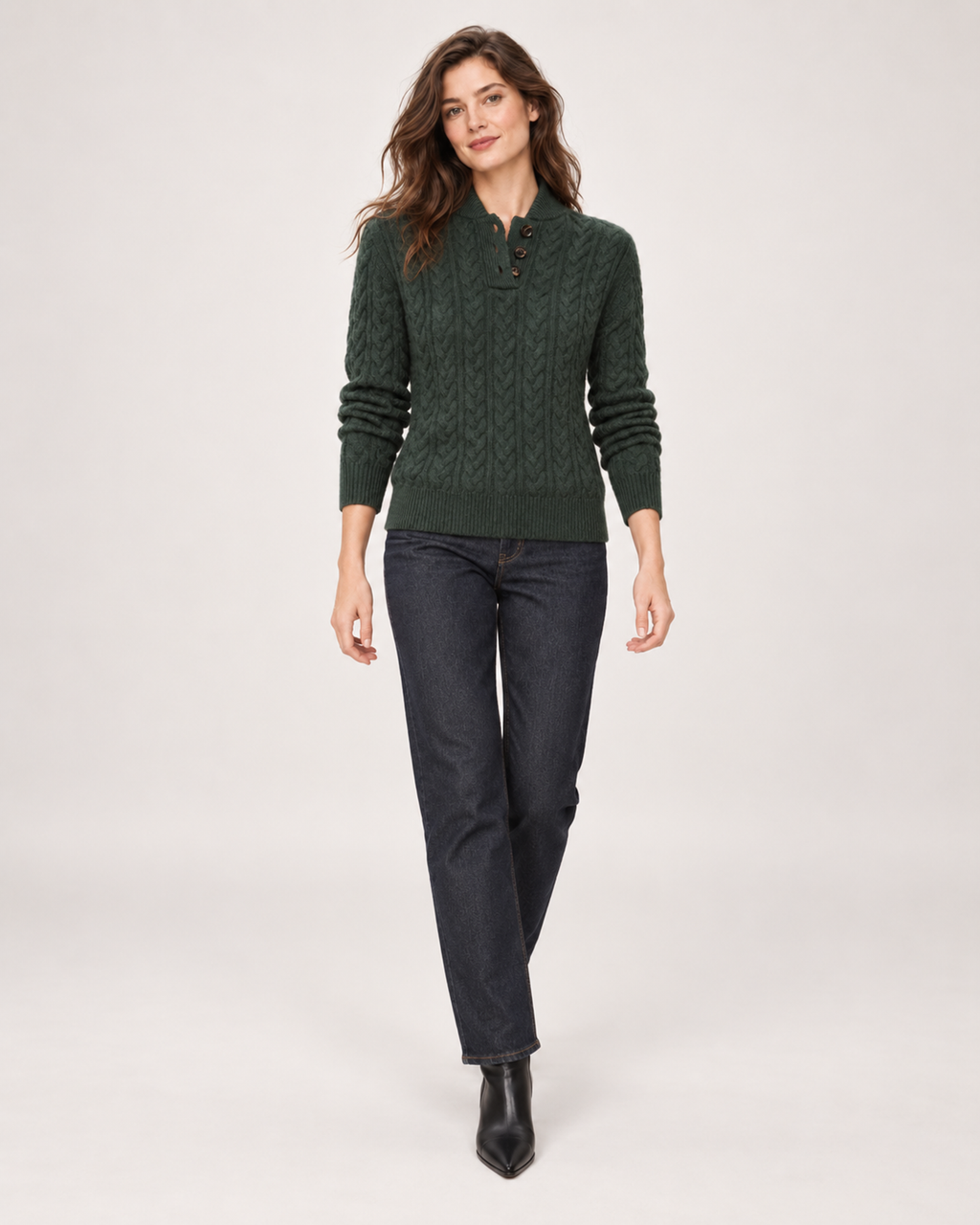 Women’s green cable knit jumper full body walking view
