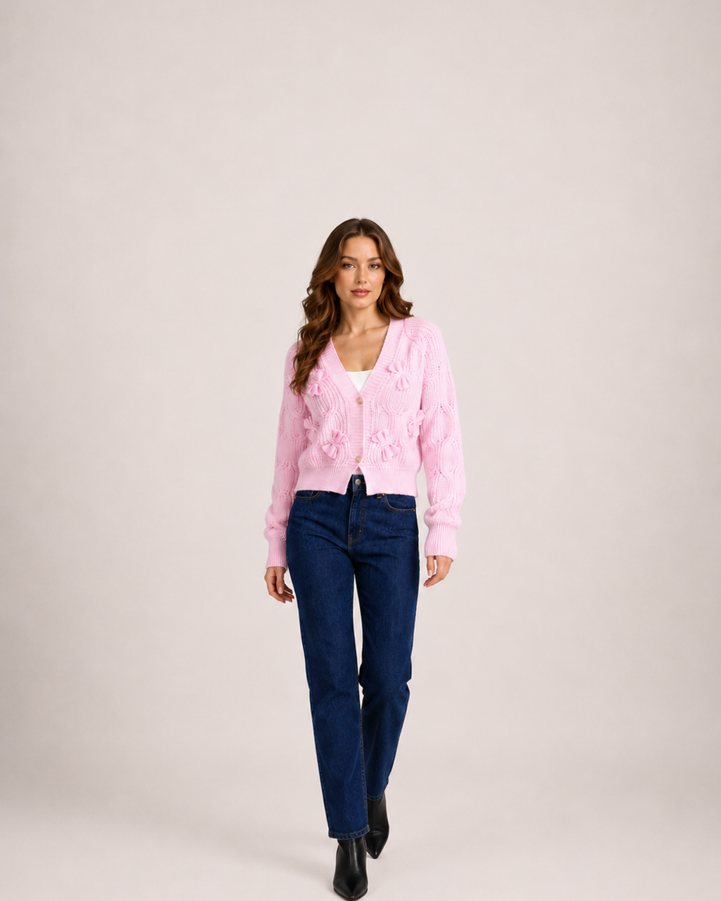 Women’s pink bow cardigan full body walking view