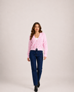 Women’s pink bow cardigan full body walking view
