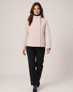 Women’s pink funnel neck coat full body walking view