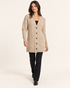 Women's beige cable knit button front coatigan walking view