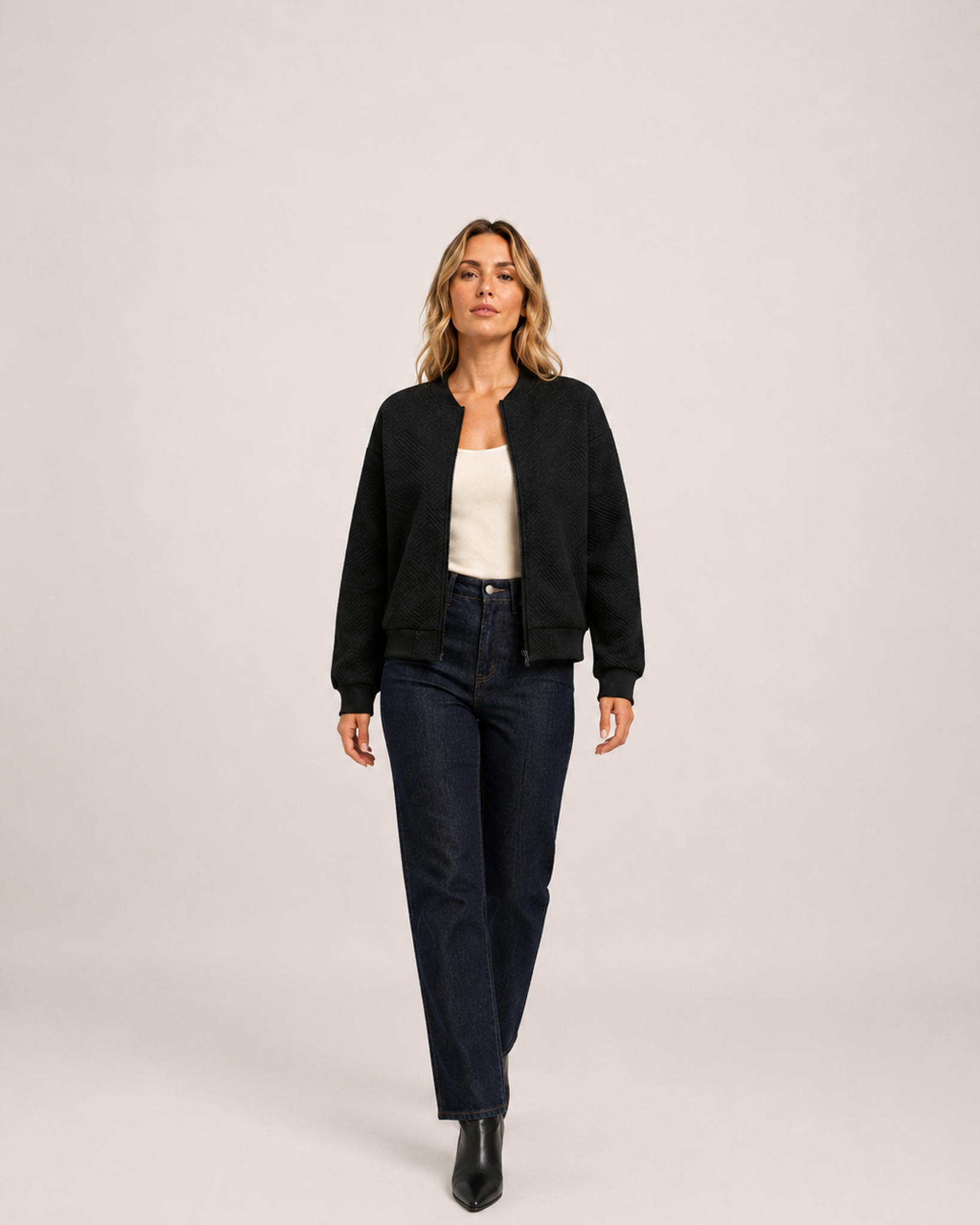 Women’s black zip up cardigan full body walking view