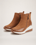 Light brown women’s wedge ankle boots in a three-quarter pair view