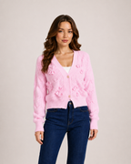 Women’s pink bow cardigan front styling view