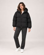 Women’s Puffer Jacket with Hood and Zip Front in Black, three quarter body view