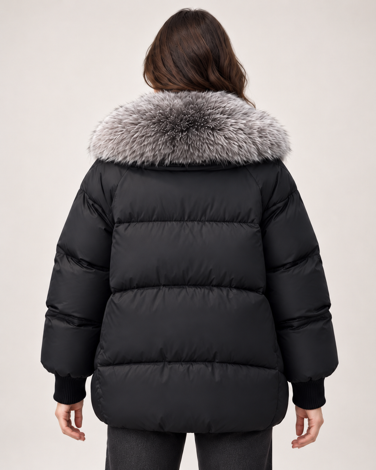 Women’s black puffer jacket with faux fur collar rear view