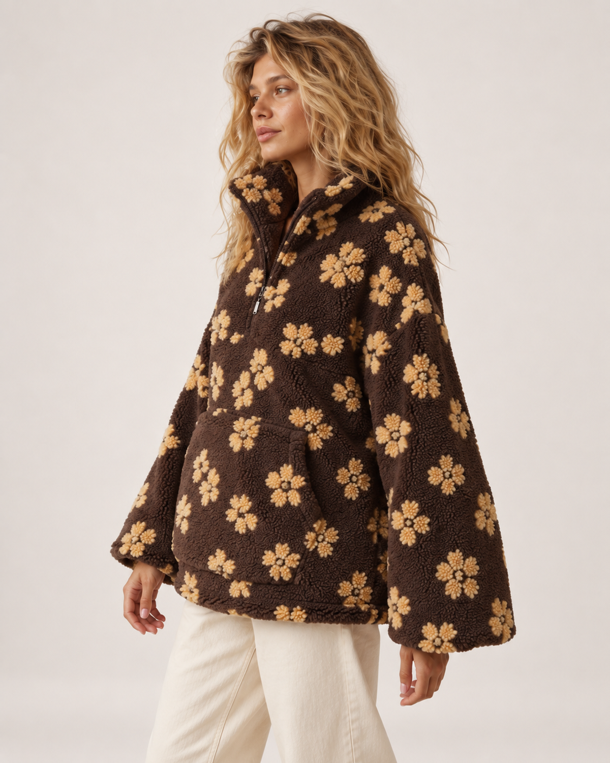 Women’s borg jacket with floral pattern and half zip near profile view