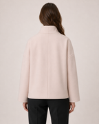 Women’s pink funnel neck coat back view