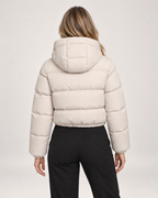 Women’s Puffer Jacket with Hood and Adjustable Hem in Beige, three quarter body view