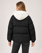 Women’s Puffer Jacket with Hood and Zip Front in Black, three quarter body view