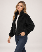 Women’s Fleece Jacket with Funnel Neck and Zip Front in Black, three quarter body view