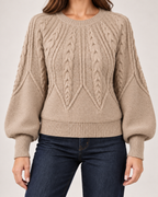 Women’s beige cable knit jumper pattern and sleeve detail