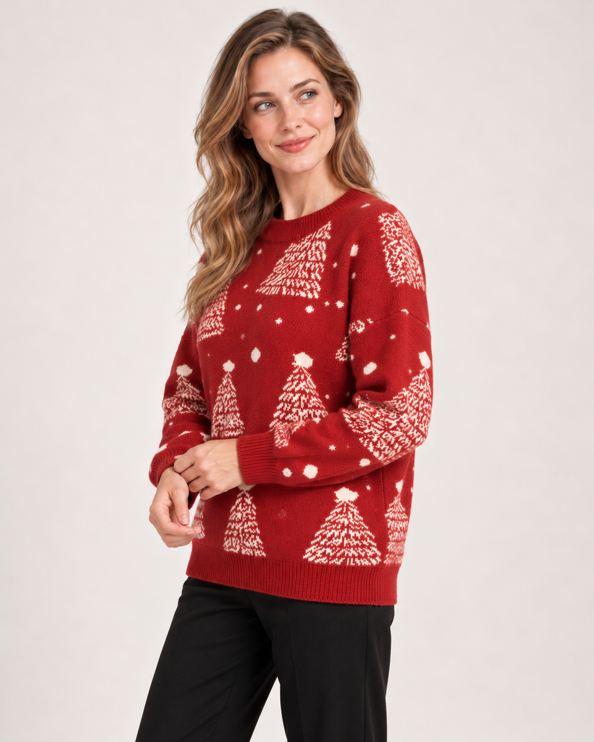Side view of women's red Christmas jumper with tree pattern