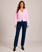 Women’s pink bow cardigan full body standing view