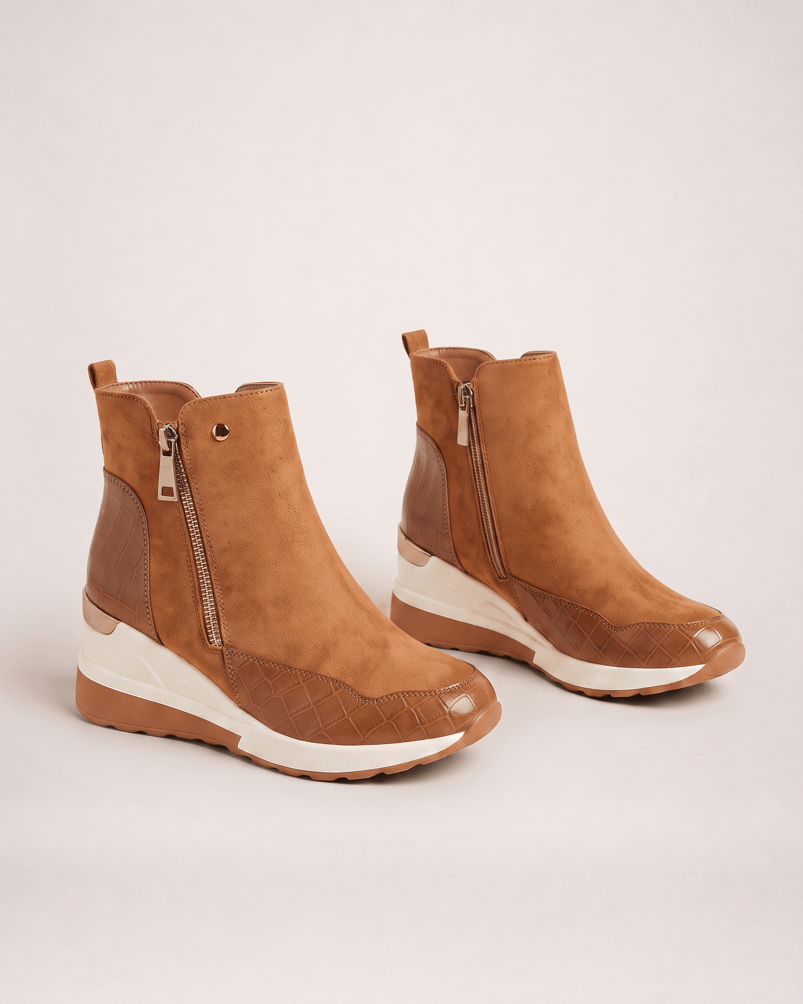Light brown women’s wedge ankle boots in a decision-helping pair view