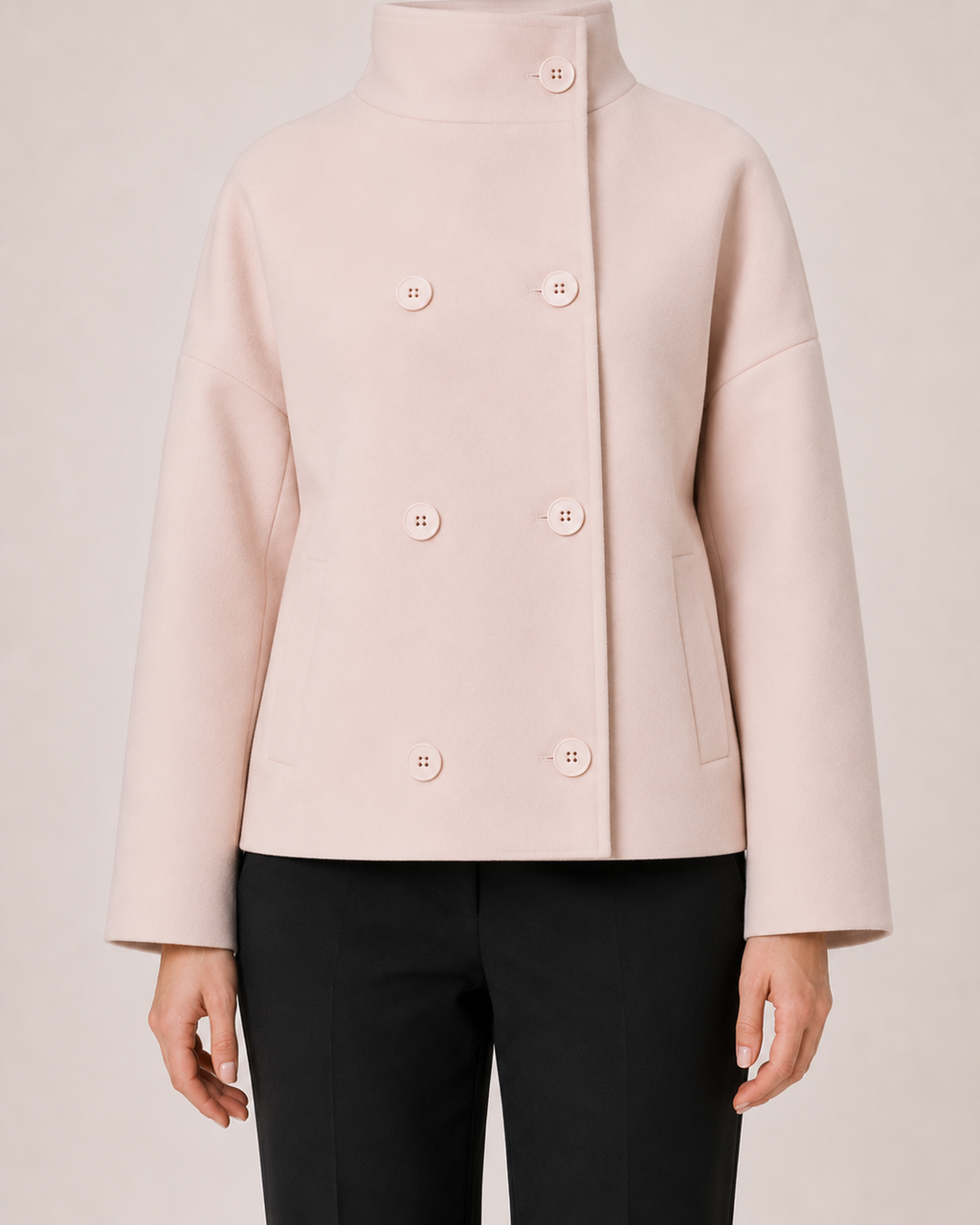 Women’s pink funnel neck coat button and pocket detail