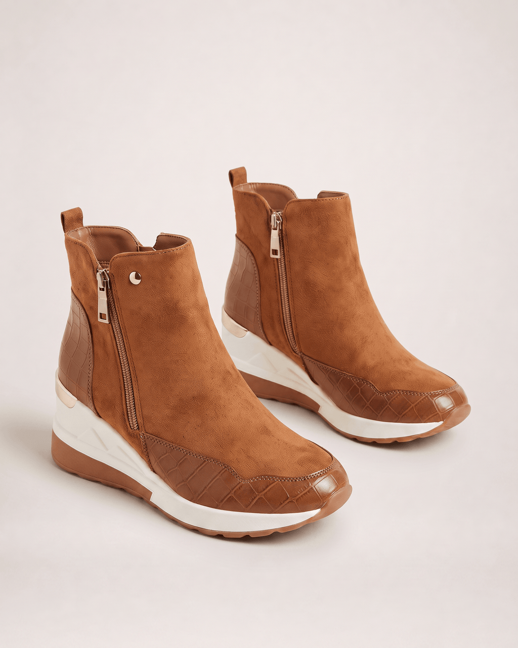 Light brown women’s wedge ankle boots in an alternative pair view