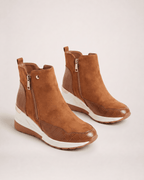 Light brown women’s wedge ankle boots in an alternative pair view