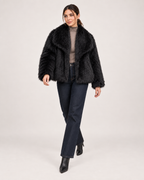 Women’s black faux fur jacket side step styling view