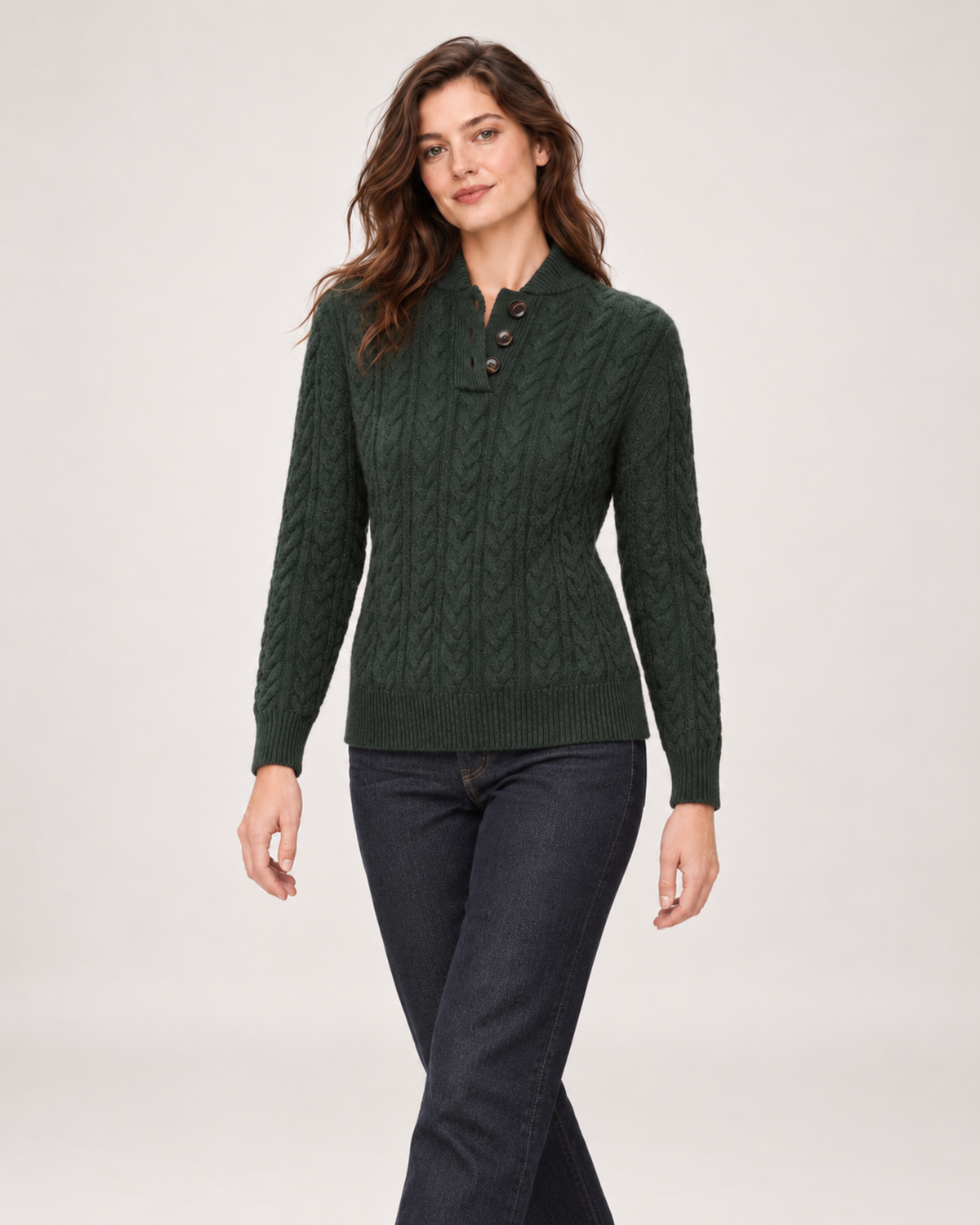 Women’s green cable knit jumper side step view