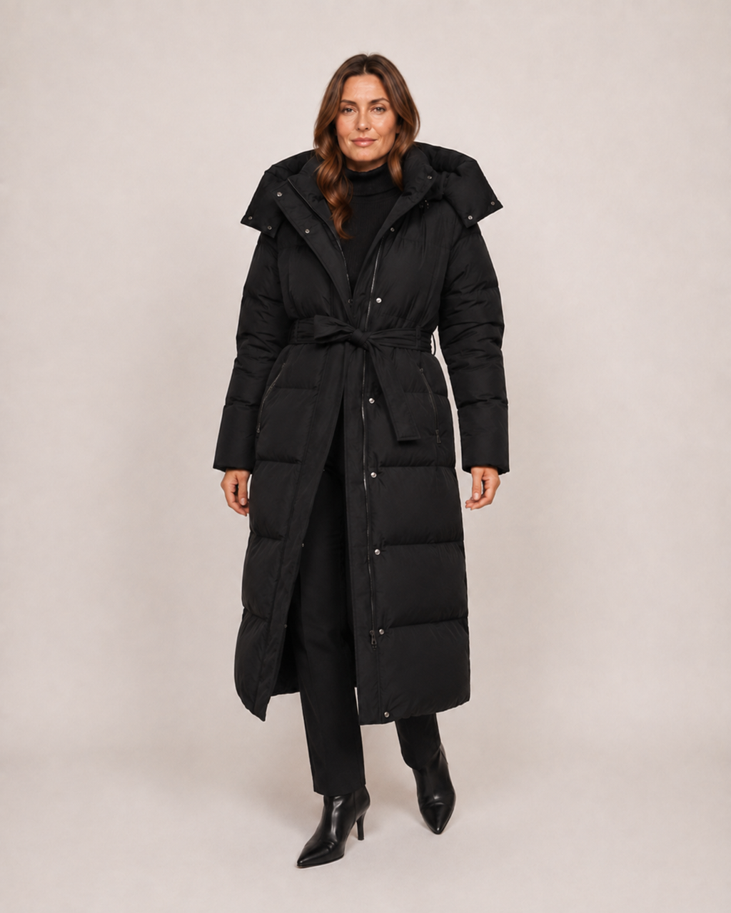Women’s Long Puffer Coat with Hood and Belt in Black, three quarter body view