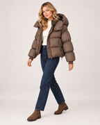 Women’s Puffer Jacket with Oversized Hood and Drawstring Hem in Brown, three quarter body view