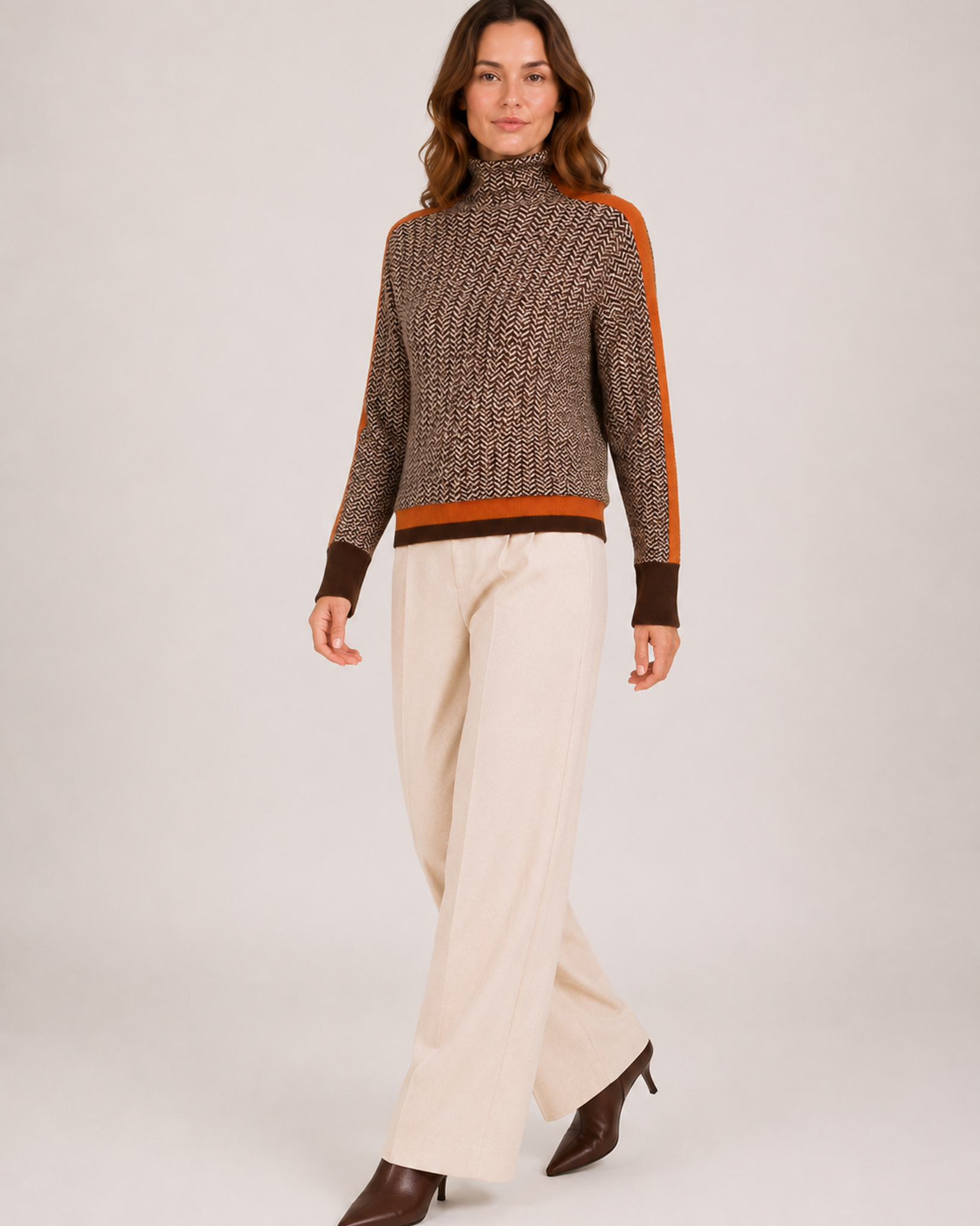 Women’s Roll Neck Jumper with Contrast Sleeves in Orange, three quarter body view