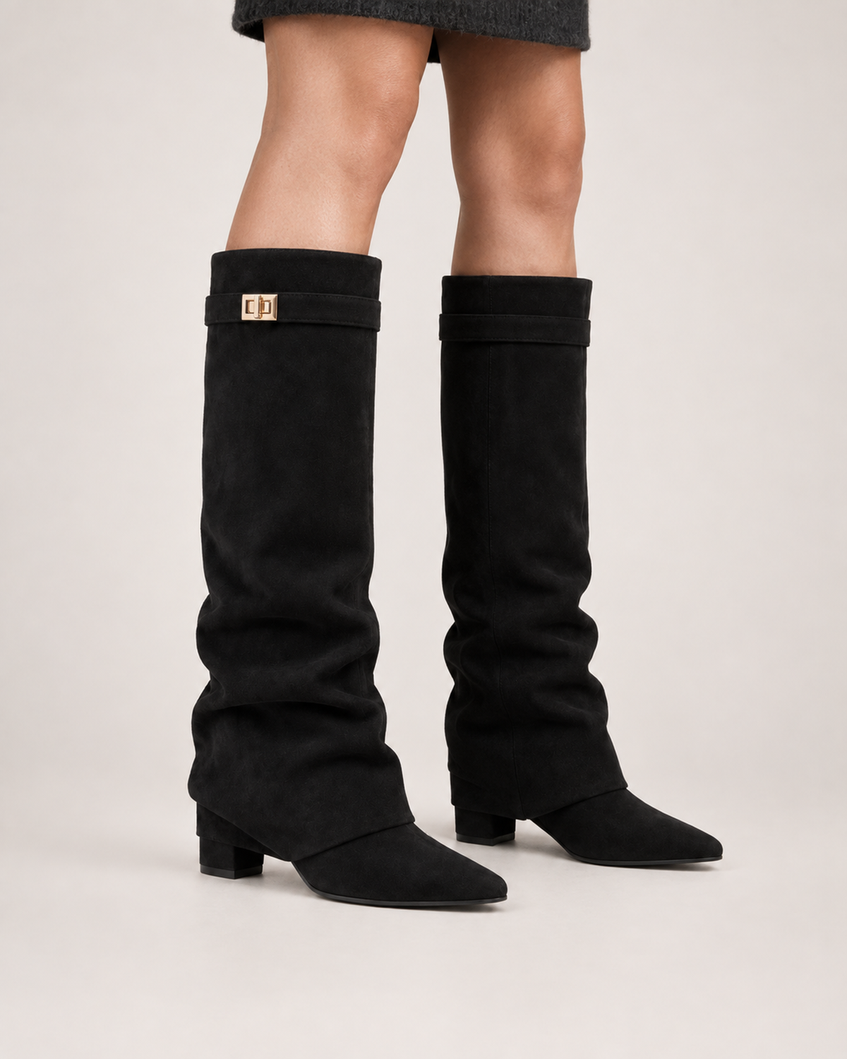 Women’s Knee High Boots with Pointed Toe and Metal Buckle in Black, worn footwear focus below knee view