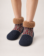 Women’s Slipper Socks with Fair Isle Pattern in Navy Blue, worn footwear focus below knee view