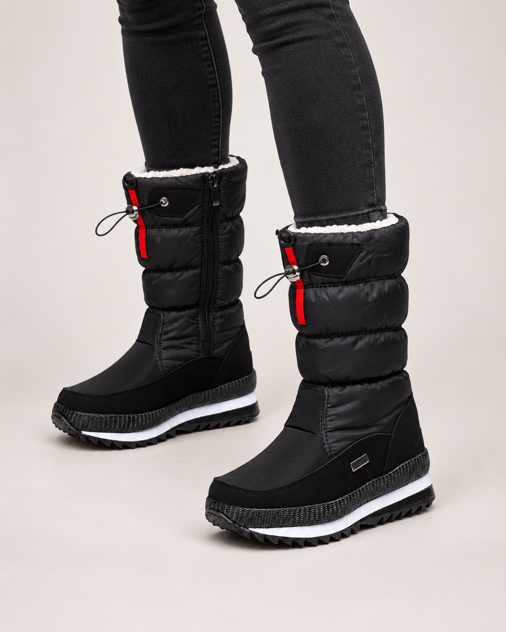 Women’s Snow Boots with Quilted Shaft and Treaded Sole in Black, worn footwear focus below knee view