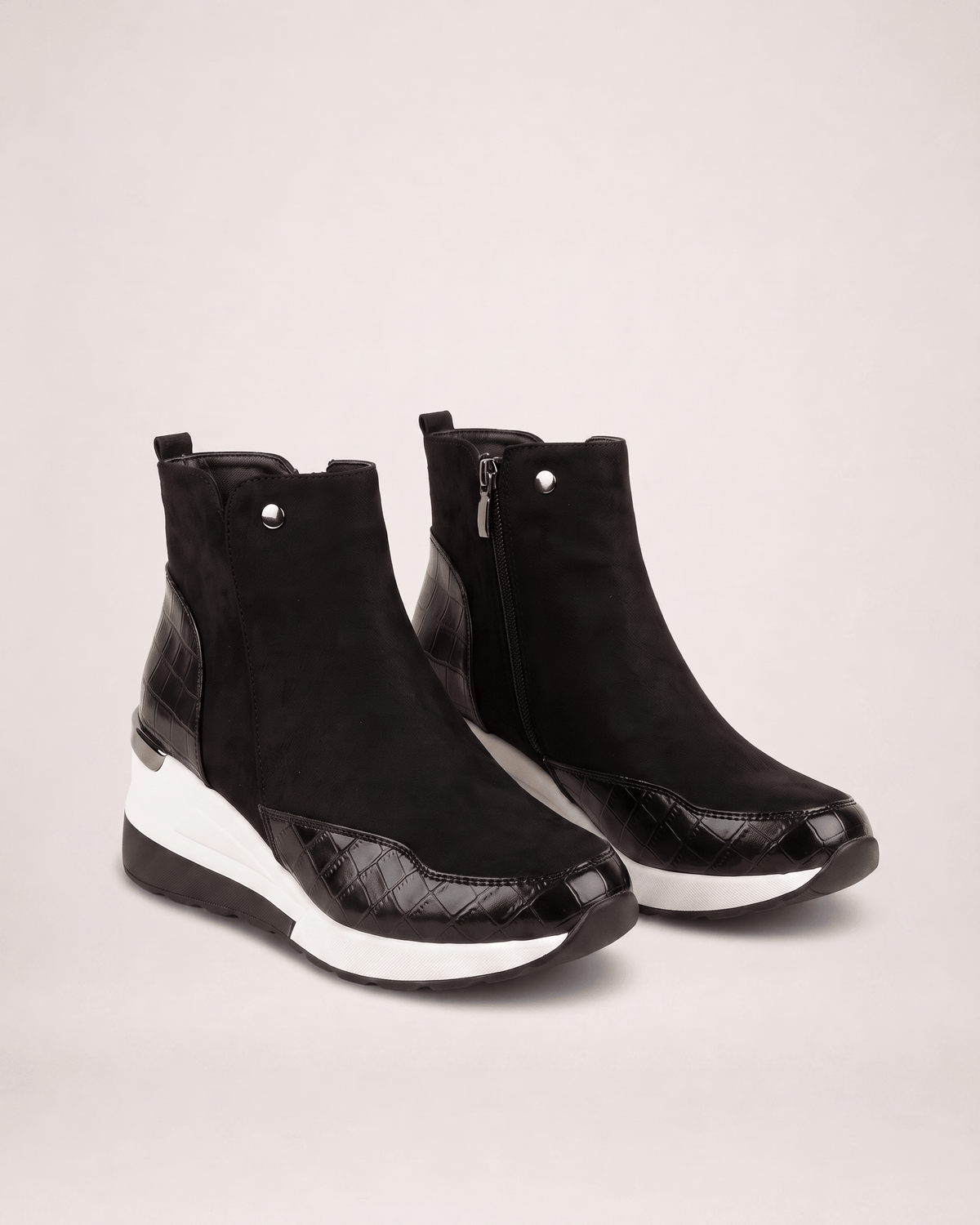 Black women’s wedge ankle boots in a three-quarter pair view