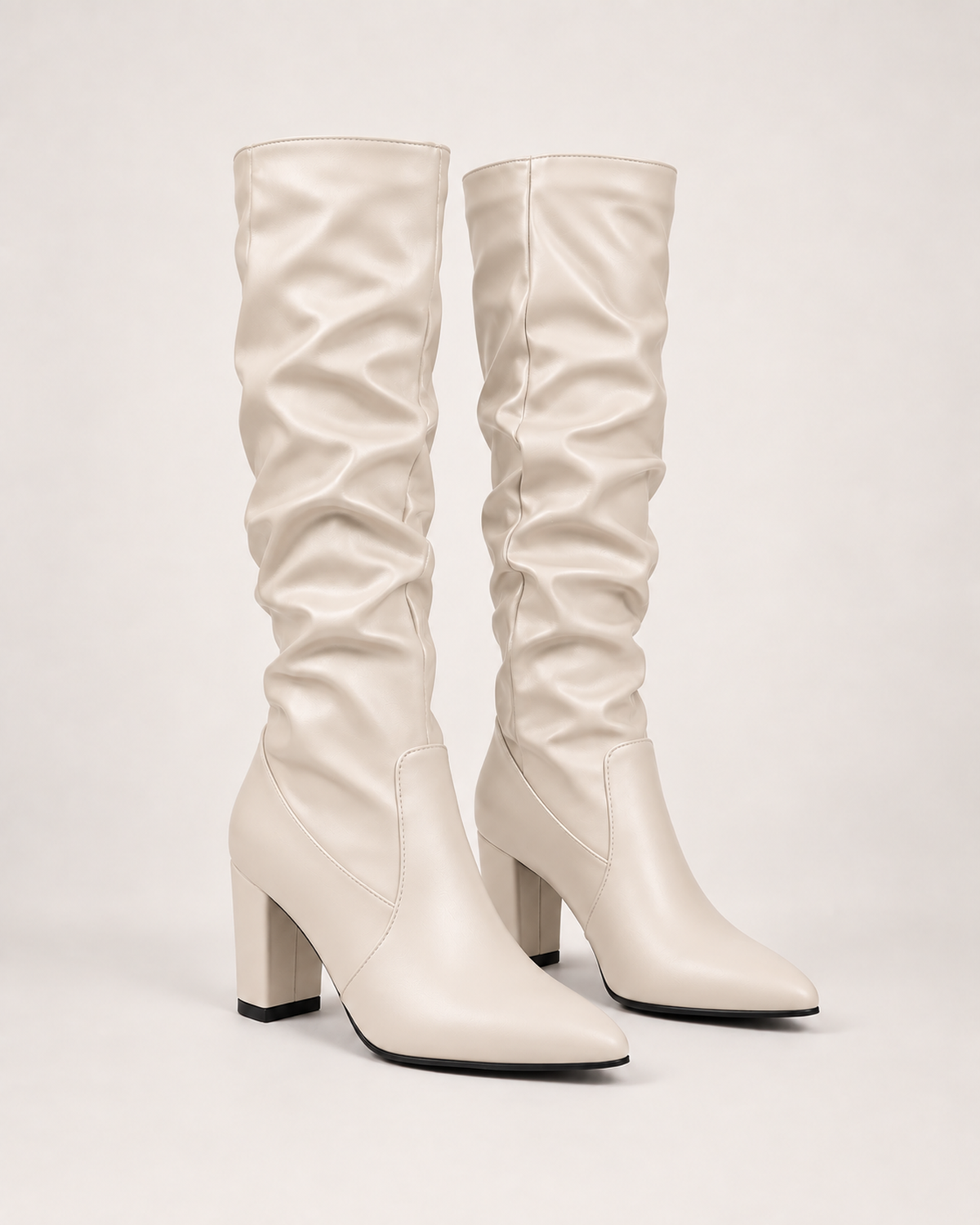 Women’s Knee High Boots with Pointed Toe and High Heel in Beige, product only pair front three quarter view