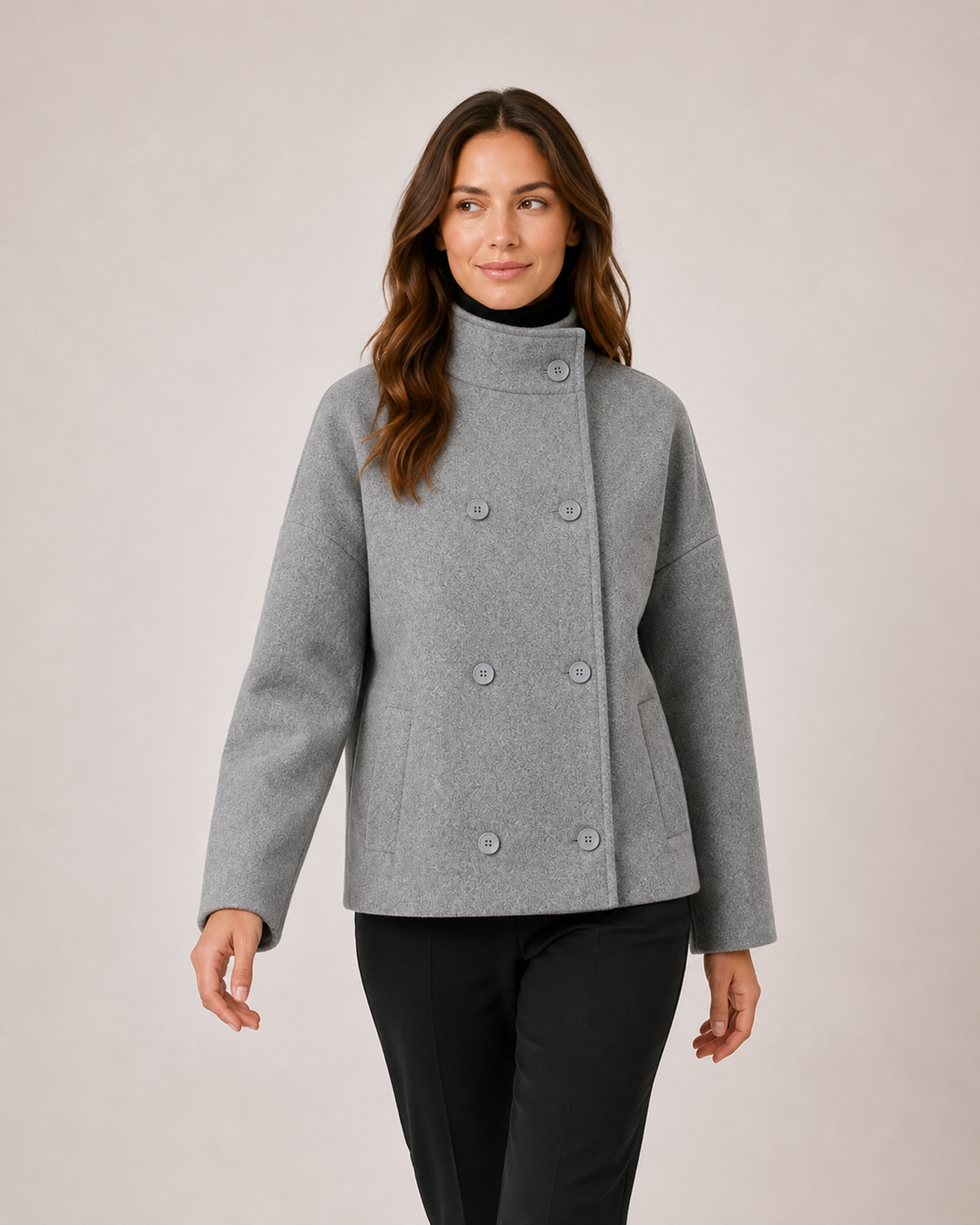 Women’s grey funnel neck coat walking view